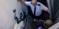 Latest Banksy Mural Covered And Guarded By Security At The Royal Courts Of Justice