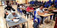 Students at the night school write exams at the Manenberg Hopeful Leaders Night school, Cape Town. (Photo: Supplied)