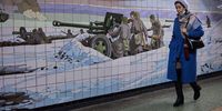 ROSTOV, RUSSIA - FEBRUARY 24: A woman walks past a wall decorated with a mosaic depicting a WWII battle scene in an underground passage on February 24, 2022 in Rostov, Russia. Early this morning, Russian President Vladimir Putin announced a military assault on Ukraine, following last week's recognition of the Donetsk People's Republic and Luhansk People's Republic, two breakaway regions in Ukraine's east. (Photo by Oleg Nikishin/Getty Images)