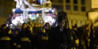 A 'Manola' from the Brotherhood of the Nuestro Padre Jesus Nazareno take part in the Santo Entierro procession during the Holy Week on March 29, 2024 in Albacete, Spain. (Photo by Juan Naharro Gimenez/Getty Images)