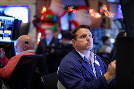 Stocks tumble as Fed projects slower rate cuts next year