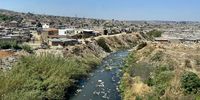 The Jukskei flowing through Alexandra township, according to Alexandra riverbank residents, used by them as a bin, because they 'don’t have any’. (Photo: Angus Begg)