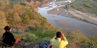 Wilderness trail visitors take in the scenery above the Mfolozi River. (Photo: Wilderness Leadership School)