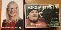 Centre Party candidates Jertta Harinen, teacher and postgraduate student, and fellow party contestant Asko Miettinen, handed out matchboxes at the meet and greet. Faces, names, some CV points and contact details all included. (Photo: Marianne Merten)<br>