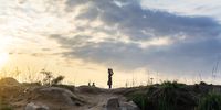 A woman carries a water bucket from a well in the early morning hours of November 22, 2020, Luveve township in Bulawayo, Zimbabwe.  It has become very difficult for most women to balance the time for work, household chores and searching for water. (Photo: Zinyange Auntony)