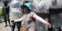 A woman shouts anti-regime slogans in front of a police line during a funeral procession of the victims killed during clashes with police at the Senkata fuel plant on November 21, 2019 in La Paz, Bolivia. (Photo: Gaston Brito Miserocchi/Getty Images)