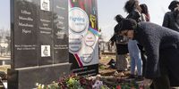 Anti-apartheid struggle veteran Sofie de Bruyn lays flowers at the joint gravesite of her friends and fellow activists Lilian Ngoyi and Helen Joseph at Avalon cemetery. (Photo: Ihsaan Haffejee)