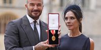 Sir David Beckham poses with his wife Lady Victoria after he was made a Knight Bachelor at an investiture ceremony at Windsor Castle on November 4, 2025 in Windsor, England. (Photo: Andrew Matthews - Pool/Getty Images)