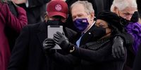 WASHINGTON, DC - JANUARY 20: House Majority Whip James Clyburn of South Carolina, and former President George Bush, take a selfie before the the 59th inaugural ceremony on the West Front of the U.S. Capitol on January 20, 2021 in Washington, DC.  During today's inauguration ceremony Joe Biden becomes the 46th president of the United States. (Photo by Patrick Semansky-Pool/Getty Images)