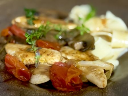 Chicken tenderloins with brown mushrooms, shallots, tomatoes and fettuccine