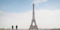 PARIS, FRANCE - MARCH 17: Police officers patrol near the Eiffel Tower during a government enforced quarantine on March 17, 2020 in Paris, France. On March 17, 2020 France imposed a nationwide lockdown to control the spread of COVID-19. (Photo by Veronique de Viguerie/Getty Images)