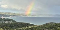 This photo was taken from our holiday home, Guava Tree Cottage’s patio. It's a view on Chintsa Bay. We live on a small farm in Chintsa West. I love the rainbow <br>