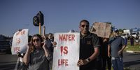 Midrand residents took to the streets on 3 February to protest against a six-day water outage. (Photo: Ihsaan Haffejee)