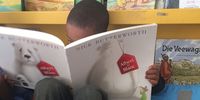 A  learner from Grahamstown Primary reads a book in IsiXhosa from the Lebone Centre’s classroom library. (Photo: Josi-Fay Salvadori)