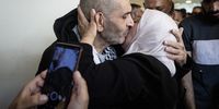 A woman embraces a newly released Palestinian prisoner, Allam Al-Ra'i from Nablus, who was among those returning from Israeli jails on October 13, 2025 in Ramallah, West Bank. Israel is expected to release 250 Palestinian prisoners, as well as 1,700 detainees from Gaza, as part of the ceasefire deal that will see the return of Israeli hostages held by Hamas.  (Photo: Faiz Abu Rmeleh/Getty Images)