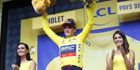 Belgian rider Greg van Avermaet (C) of the BMC Racing Team celebrates on the podium after taking the overall leader's yellow jersey following the 3rd stage of the 105th edition of the Tour de France cycling race, a 35.5km team time trial, in Cholet, France, 09 July 2018.  EPA-EFE/KIM LUDBROOK