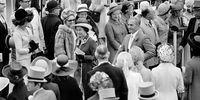 Queen Elizabeth II with Mohammad Reza Pahlavi, Shah of Iran, walking among the racegoers attending the Royal Ascot race meeting at Ascot racecourse, in Ascot, Berkshire, England, 21 June 1972. (Photo: Blackman/Daily Express/Hulton Archive/Getty Images)