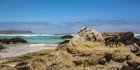 [Slangkop Lighthouse (Kommetjie) from Noordhoek Beach at the foot of Chapman's Peak]. Photographer: [Neville Lance].
