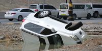 A damaged car after heavy rain in Fujairah, United Arab Emirates, 29 July 2022. The UAE Authorities placed around 4,000 in temporary accommodation after they were affected by heavy rain that also caused waterlogged roads and damages in many of buildings, shops and homes in some cities from the UAE.  EPA-EFE/ALI HAIDER