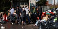 Local residents drop off their rubbish at a drop off point at a community centre in Birmingham, Britain, 03 April 2025. Trash is piled high on residential streets across the city due to an ongoing bin strike. Birmingham City Council has declared a major incident over the strike. Refuse collectors are striking over pay and working conditions.  EPA-EFE/ANDY RAIN