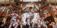Members of Ewell St. Mary's Morris Men dancing team perform Morris dance at Leadenhall Market to celebrate St George's Day in London, Britain, 23 April 2024. Morris dancing is a form of English folk dance that roots back to the 15th century. Saint George's Day is celebrated by Christian churches on 23 April, the traditionally accepted date of the saint's death.  EPA-EFE/TOLGA AKMEN
