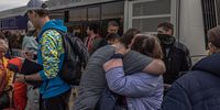 epa09924946 People hug each other after arriving on a bus on which people were evacuated from the steel plant Azovstal, Mariupol city and the surrounding areas, at the evacuation point in Zaporizhzhia, Ukraine, 03 May 2022. Around 100 civilians were evacuated from the steel plant, the last Ukrainian-controlled area in the southern port city of Mariupol, according to Ukrainian officials. Thousands of people who were still in Mariupol and other areas in South Ukraine occupied by the Russian army waited to be evacuated to Ukraine's controlled area by buses and their own cars.  EPA-EFE/ROMAN PILIPEY