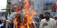 Indian National Congress (INC) party activists burn the effigies of Uttar Pradesh Chief Minister Yogi Adityanath (L) and Union Minister of Railways Ashwini Vaishnaw during a protest calling for their resignations over the recent deadly stampedes, in Kolkata, West Bengal, India, 17 February 2025. Weeks after dozens were killed in a stampede at Kumbh Mela religious festival, another stampede occurred at New Delhi Railway Station on 15 February.  EPA-EFE/PIYAL ADHIKARY