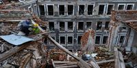 KHARKIV, UKRAINE - SEPTEMBER 28: Oleksandr Ibrahimov, 56, a security guard working for 35 years at the House of Trade Unions has found a sunflower growing amongst the wreckage while clearing debris on the rooftop of the building on September 28 2022 in Kharkiv, Ukraine.The attack also hit a power plant knocking out electricity to 18,000 residents of Kharkiv. In recent weeks, Ukrainian forces have reclaimed villages east and south of Kharkiv, as Russian forces have withdrawn from areas they've occupied since early in the war. (Photo by Paula Bronstein/Getty Images)