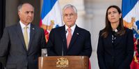 Chilean President Sebastian Pinera, centre, flanked by the Minister of the Environment, Carolina Schmidt, right, and the Foreign Minister, Teodoro Ribera, left, announces that Chile will not organise COP25 due to protests and demonstrations in the country.  (Photo: EPA-EFE / Marcelo Segura / Presidency of Chile handout)
