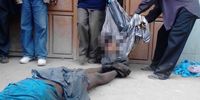 The body of Hassan Omondi Owiti in the blue t-shirt, and his dead wife, being carried out from the scene of an RRT raid. Pixelation by Declassified. (Photo: Kevin Midigo)<br>