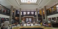 The banking floor is used for TV programmes, tables where the students hang out. (Photo: Supplied)<br>