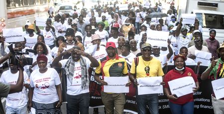 Jobless youth heading to Parliament unknowingly join Sekunjalo's #RacistBanksMustFall march