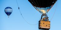 Teachers and students of the Oroshaza Liszt Ferenc School of Art play music with wind instruments in the basket of a hot air balloon during the second hot air balloon fiesta near Oroshaza, south-eastern Hungary, 05 September 2019.  EPA-EFE/Tibor Rosta