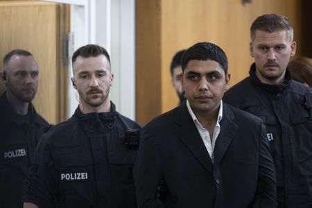 German court hears case of Afghan accused of killing man, toddler in knife attack