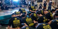 HONG KONG, CHINA - JULY 09: The University of Hong Kong student union executive committees attend a press conference as they issue an apology at the University of Hong Kong on July 9, 2021 in Hong Kong, China. University of Hong Kong Student Union leaders resigned en mass after government officials state motion mourning the man who knifed a policeman akin to terrorism.(Photo by Anthony Kwan/Getty Images)