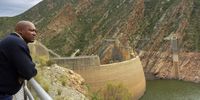 Kouga dam caretaker Vuyani Dlomo looks over the dam that is now only 4.5% full, the lowest level since its construction between 1959 and 1969. (Photo: Deon Ferreira)