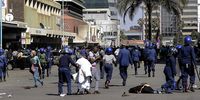 Injured demonstrators lie in the street as a protest is driven back by riot police in 2019 in Harare, Zimbabwe. (Photo: Tafadzwa Ufumeli / Getty Images)
