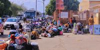 Undocumented immigrants queue outside the Department of Home Affairs offices in Musina