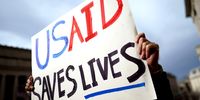 A protester outside the US Agency for International Development (USAID) in Washington, DC on 3 February 2025. USAID staff have been instructed to stay away from the agency's Washington headquarters following an announcement by Elon Musk that President Donald Trump had agreed with him that the agency should be shut down. (Photo: EPA-EFE / Will Oliver)