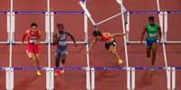 Shunsuke Izumiya of Team Japan (2nd R) falls over a hurdle as (L-R) Junxi Liu of Team People's Republic of China, Dylan Beard of Team United States and Thiago Resende Ornelas Dos Santos of Team Brazil compete during the Men's 110 Metres Hurdles Semi-Finals on day four of the World Athletics Championships Tokyo 2025 at National Stadium on September 16, 2025 in Tokyo, Japan. (Photo by Patrick Smith/Getty Images)