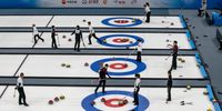 BEIJING, CHINA - APRIL 01: Curlers from China's curling team play during a mixed test event for the Beijing 2022 Winter Olympics at the Water Cube on April 1, 2021 in Beijing, China. The events, which run from April 1-10, are the first tests at these venues for the games which are set to open on February 4, 2022.  (Photo by Kevin Frayer/Getty Images)