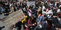 SANTIAGO, CHILE - SEPTEMBER 19: Demonstrators holds up signs and chant during the global climate strike at Plaza Italia on September 20, 2019 in Santiago, Chile. Strikes are being held all around the world to protest against government and business inaction on climate change. This initiative is led by 16-year-old Swedish climate activist Greta Thunberg ahead of the Climate Action Summit to be held on September 23. (Photo by Marcelo Hernandez/Getty Images)