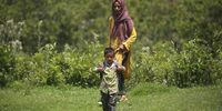 A Kashmiri nomadic child heads for a seasonal school set up for the migrating tribes in Sangarwani Pulwama, some 80 km south of Srinagar, the summer capital of Indian Kashmir, 08 August 2023. The Gujjars and Bakerwals are nomadic pastoralists of Kashmir whose livelihood depends upon rearing livestock. As the temperature begins to rise in the plains of Jammu region of Indian Kashmir, the Gujjar and Bakerwal tribes embark on their centuries-old tradition of seasonal migration towards the upper reaches of Kashmir Himalayas. As a result of which their children are not able to attend regular schools. However, the Indian Kashmir government has recently established seasonal schools to ensure that the children of the 1.5 million population of nomadic Gujjar and Bakerwal communities continue their education. Climate change has also put a pall over their historic way of life, as the traditional routes they used to move are now subject to unpredictable weather patterns, making the mountain roads they rely on even more unreliable.  EPA-EFE/FAROOQ KHAN