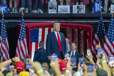 Judge partially lifts Trump hush money gag order