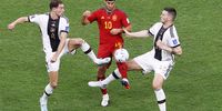 epa10333217 Marco Asensio of Spain (C) in action against Leon Goretzka (L) and Niklas Sule (R) of Germany during the FIFA World Cup 2022 group E soccer match between Spain and Germany at Al Bayt Stadium in Al Khor, Qatar, 27 November 2022.  EPA-EFE/Rungroj Yongrit