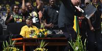 JOHANNESBURG, SOUTH AFRICA - APRIL 19:  African National Congress (ANC), presidential favorite Jacob Zuma dances at a campaign rally April 19, 2009 in Johannesburg, South Africa as former president Nelson Mandela looks on. Mandela, age 90, made a surprise appearance at the ANC's final major election rally ahead of national elections on Wednesday. The ANC is expected to win by a wide margin but faces its toughest competition from rival parties yet, since it came to power in 1994.  (Photo by John Moore/Getty Images)