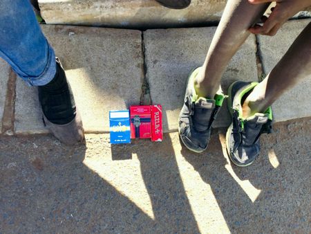 Schoolchildren sell cigarettes to help parents make ends meet