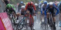 epa10619531 Several riders crash in the background while Australian rider Kaden Groves (R) of team Alpecin-Deceunnick crosses the finish line to win the fifth stage of the 2023 Giro d'Italia cycling race over 171 km from Atripalda to Salerno, Italy, 10 May 2023.  EPA-EFE/LUCA ZENNARO
