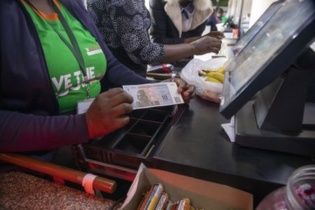 Fintechs Fly Planes of Cash Into Zimbabwe to Meet Demand for Dollars