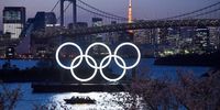 A boat sails past the Tokyo 2020 Olympic Rings on March 25, 2020 in Tokyo, Japan. Following yesterdays announcement that the Tokyo 2020 Olympics will be postponed to 2021 because of the ongoing Covid-19 coronavirus pandemic, IOC officials have said they hope to confirm a new Olympics date as soon as possible. (Photo by Carl Court/Getty Images)